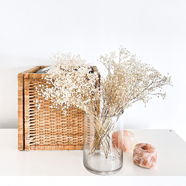 Decorative objects with biophilic elements, rattan weave, baby's breath flowers, Himalyan salt candle holders | Photo by Mir Martz