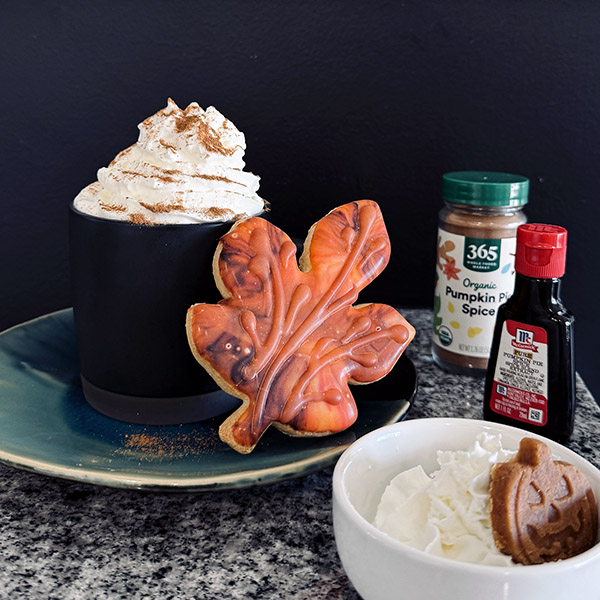Pumpkin spice latte with a pup cup | Apricot's Home Pumpkin spice latte and pup cup with pumpkin treat | Photo by Mir Martz