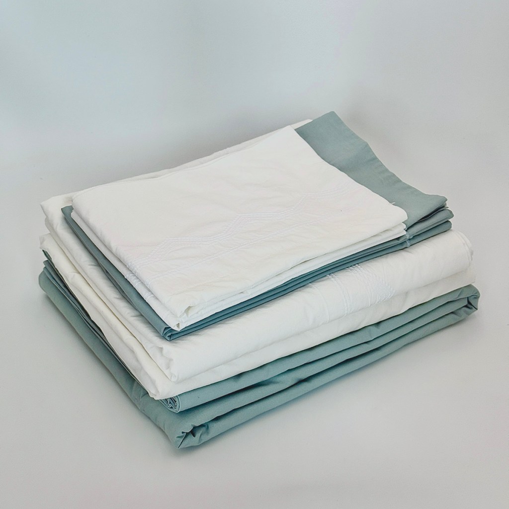 Designer cotton sheet and duvet set for a queen bed, weighing 7.5 pounds | Photo by Mir Martz