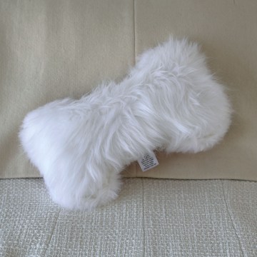 The Heritage Bone Dog Toy in Fur in White Fox / Pink | Photo by Mir Martz