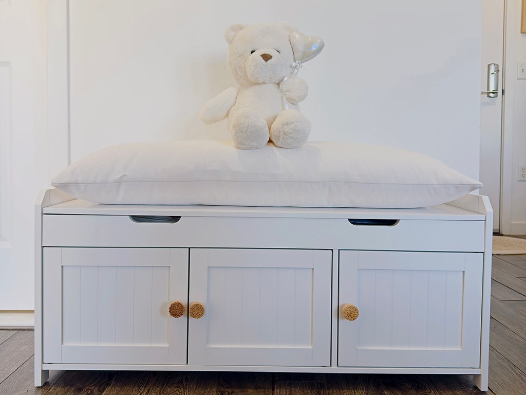 Storage bench after upgrading cabinet pulls and bench seat pillow | Photo by Mir Martz