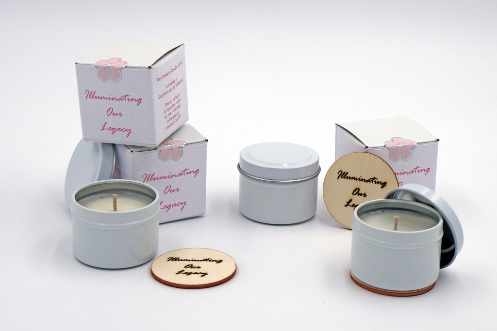 Apricot’s Home Blossom Candle in a deluxe tealight-size candle jar with a commemorative wood coaster and custom packaging for America’s 250th | Photo by Mir Martz